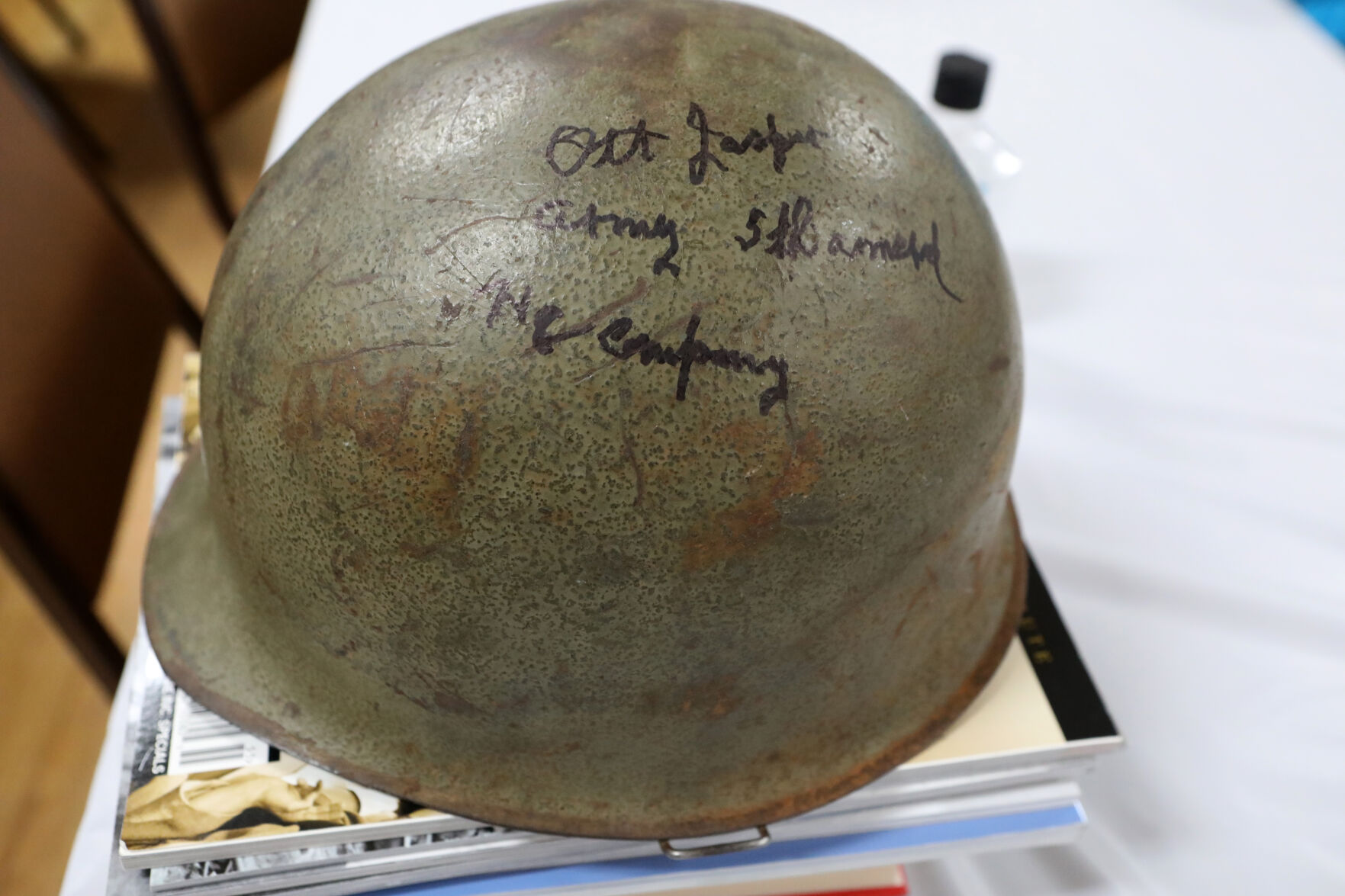 World War II helmet with signatures